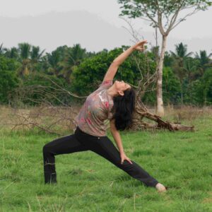 Girl doing viprita veerbhadra asana